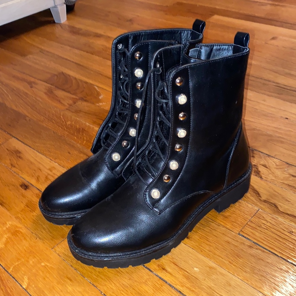 Black combat boots with studs and pearl detail
